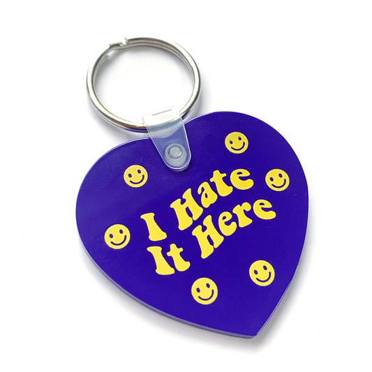 "I Hate It Here" Purple Happy Face Heart Shaped Vinyl Keychain (Krystan Saint Cat)