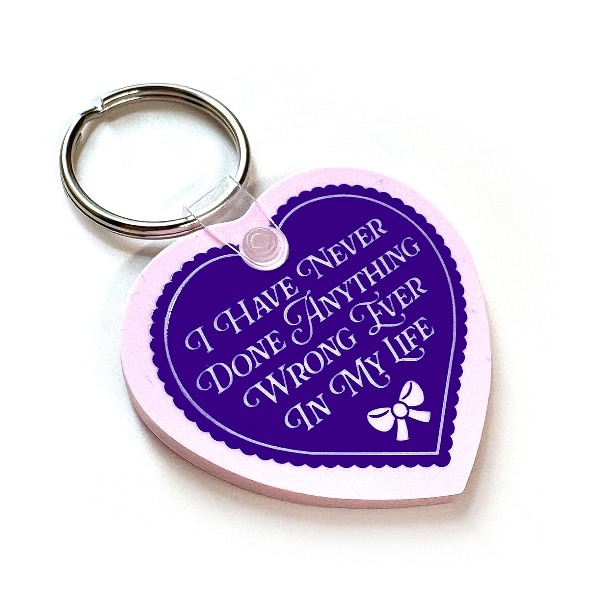 "I Have Never Done Anything Wrong" Heart Shaped Vinyl Keychain (Krystan Saint Cat)