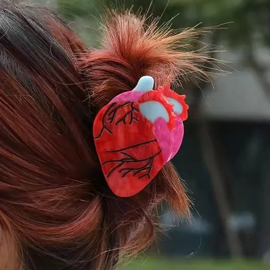 Four different hair accessories styled in a person's hair with various text and designs.