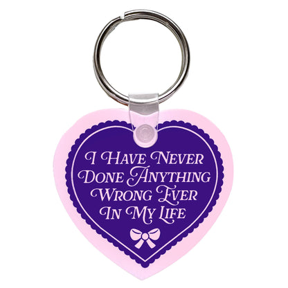 "I Have Never Done Anything Wrong" Heart Shaped Vinyl Keychain (Krystan Saint Cat)
